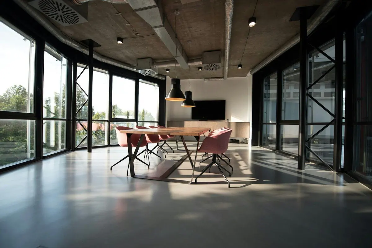 Well-lit meeting room — TISEZA one-stop submissions run through registered investor service providers